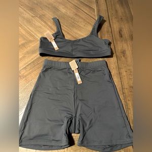 Brand new SKIMS swim bundle gunmetal color biker bottom-small sports bra top- L